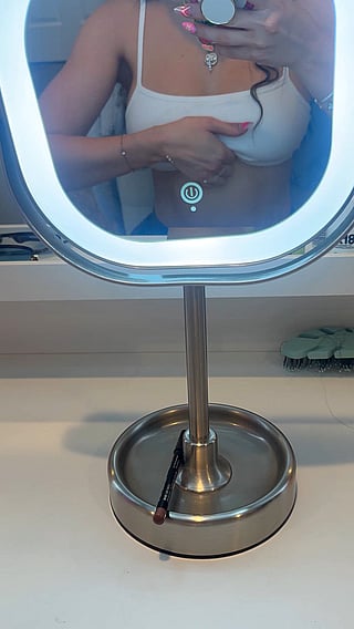 Showing off the boobs while getting ready for work'