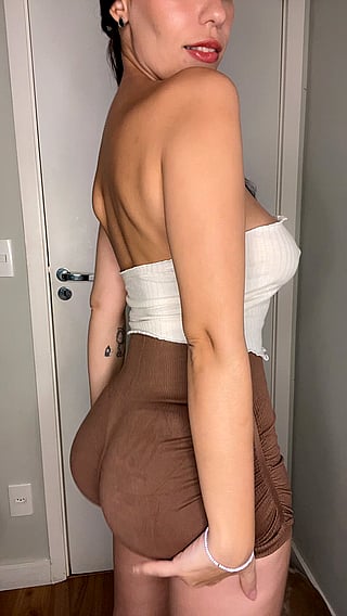 Busty Babe with Big Tits Showing Off Her Curves'