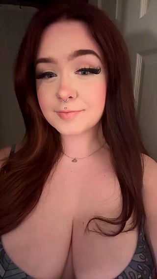 Redhead with Piercing and Tattoos Shows Off Her Big Tits'