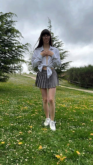 Cute Reveal in Nature: A Girl Shows Off Her Skirt in the Field'