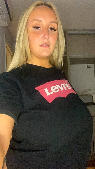 Big Enough for You: A Busty Blonde in a Jeans Shirt'