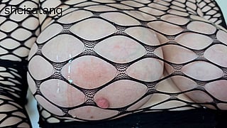 Fishnets and Oil: A Perfect Pairing for Big Tits'