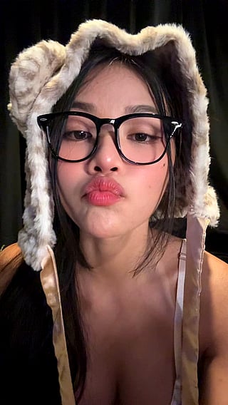 Big Tits and Glasses: A Close-Up of a Woman's Face'