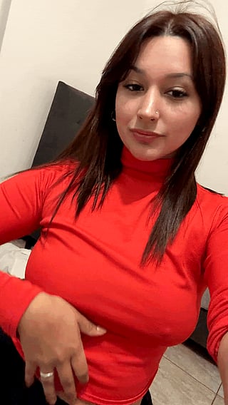 Showing off my boobs in a red shirt'