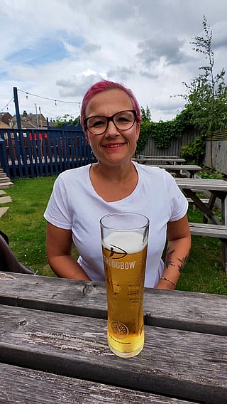 Busty Babe Sipping on a Cold One'