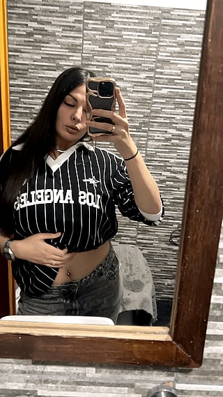 Reveal in the Bathroom: A Chick Shows Off Her Piercing'