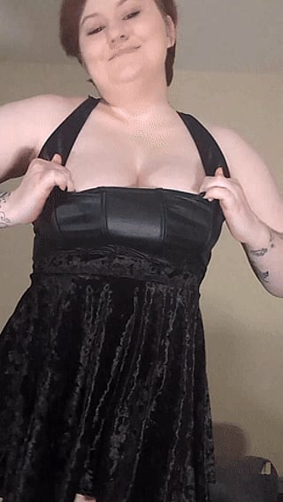 A Flash of Cleavage: A Woman's Black Dress'
