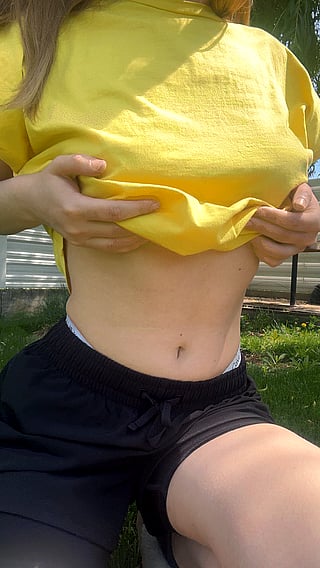Taking Off the Yellow T-shirt to Reveal the Boobs'
