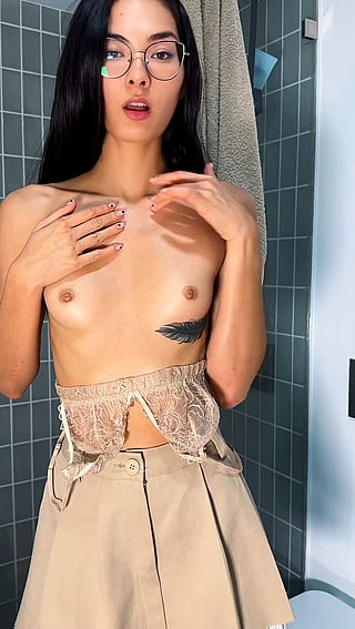 Asian girl with tiny tits shows off her flat chest'