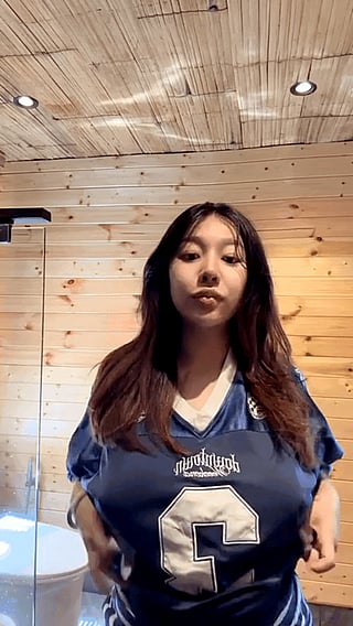 Big Boobs Revealed: A Chick Showing Off Her Large Breasts'