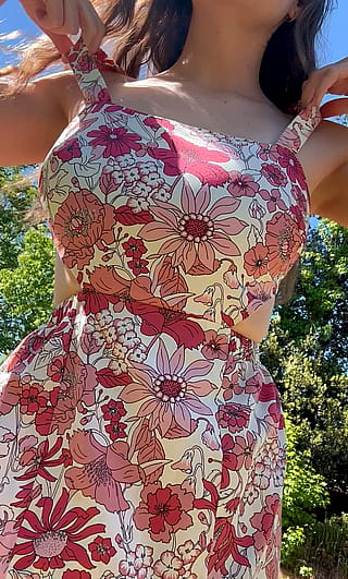 I love the way they pop out of this sundress'