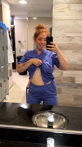 Showing off my nurse tits while on break (titty drop)'